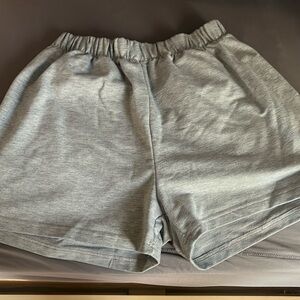 gray shorts with sun and moon on pockets